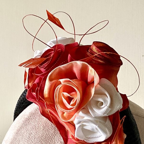 Olivia_decoration_close-up_black straw halo with vintage ribbon roses and coque feathers